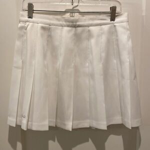 Head Ladies Tennis Skirt. Flat Front.‎  Sewn down Pleats at Top of Skirt. 14.